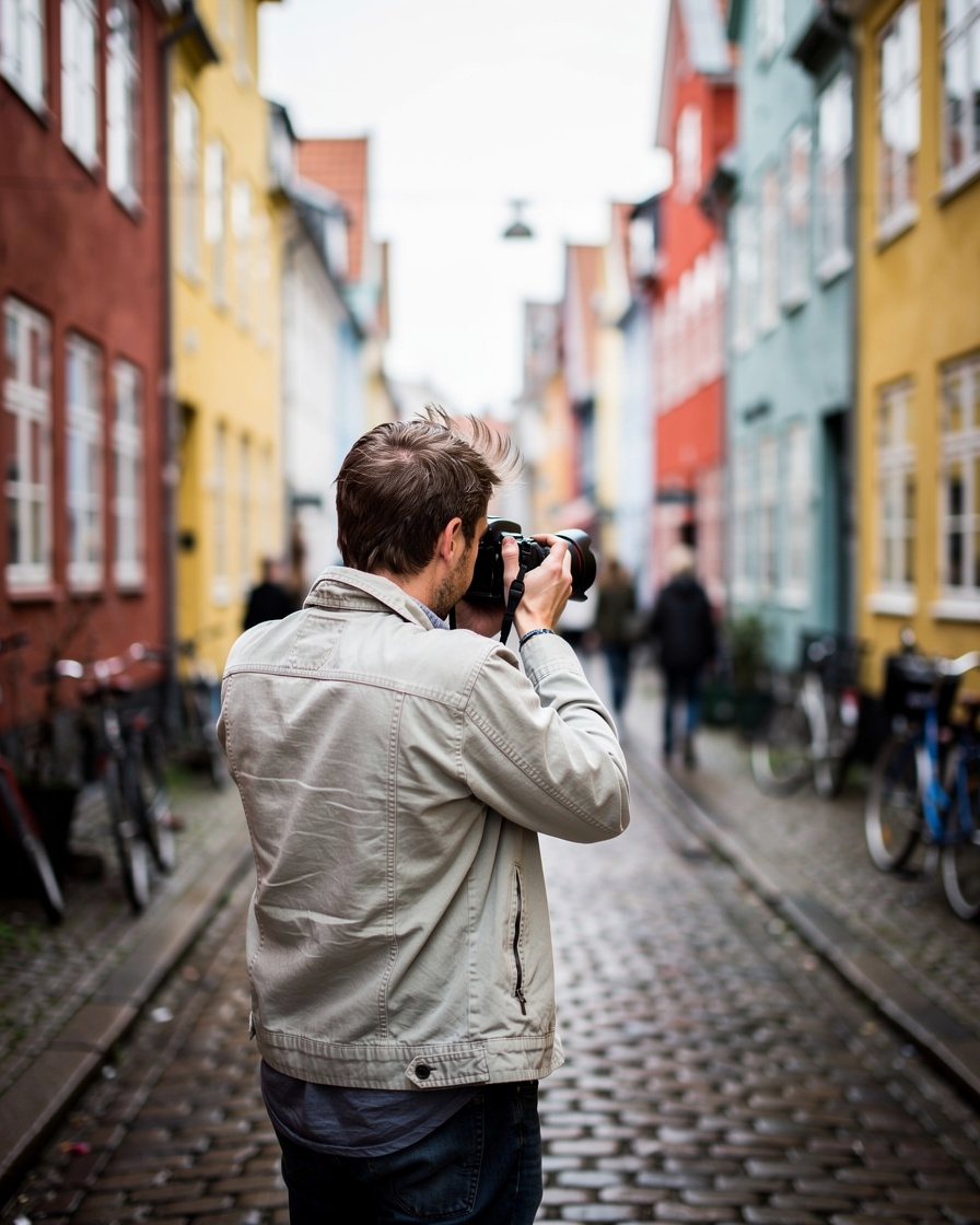 Documentary photographer taking a picture on a Danish street